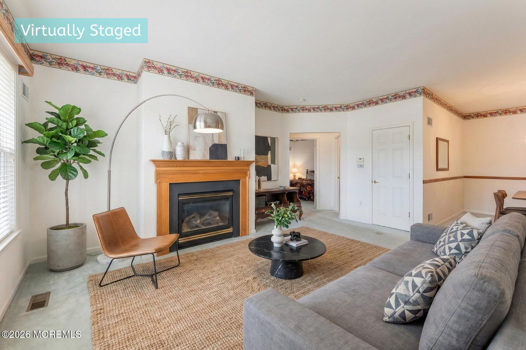 22 Foxwood Road Lakewood, NJ 08701 - Photo 7 of 35 a living room with furniture and a fireplace