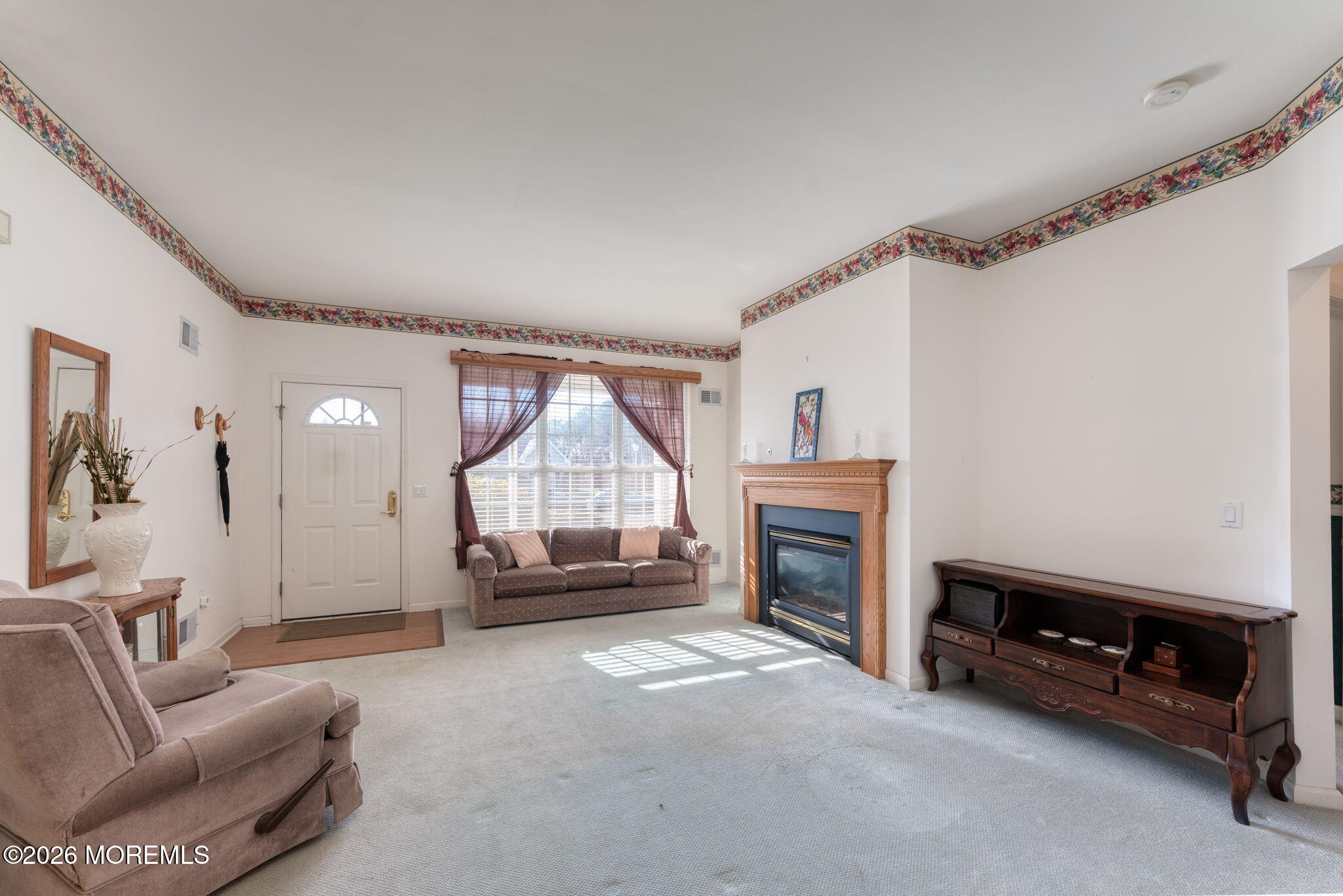 22 Foxwood Road Lakewood, NJ 08701 - Photo 8 of 35 a living room with furniture a fireplace and a flat screen tv
