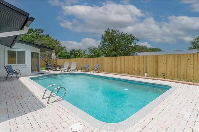 a view of a swimming pool with a patio