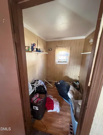 a bedroom with bed and a window