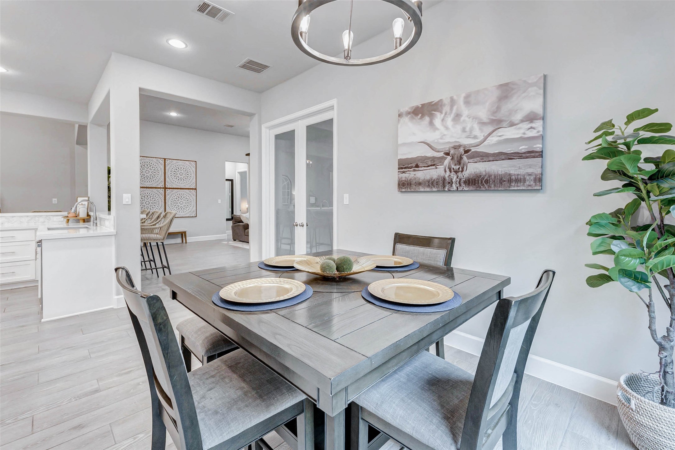 4714 Southpoint Way Fulshear, TX 77441 - Photo 13 of 45 a view of a dining room with furniture and wooden floor