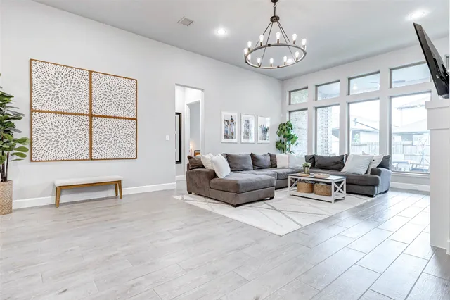 a front view of a house with a yard and porch