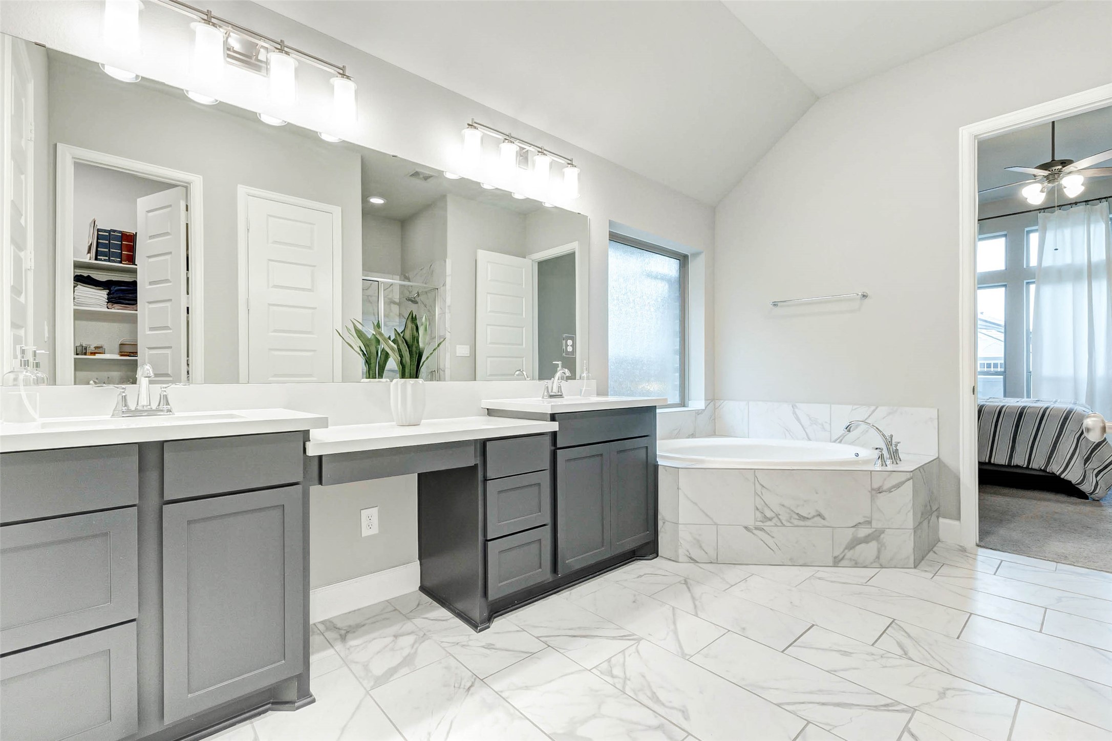 4714 Southpoint Way Fulshear, TX 77441 - Photo 18 of 45 a spacious bathroom with a tub sink and mirror