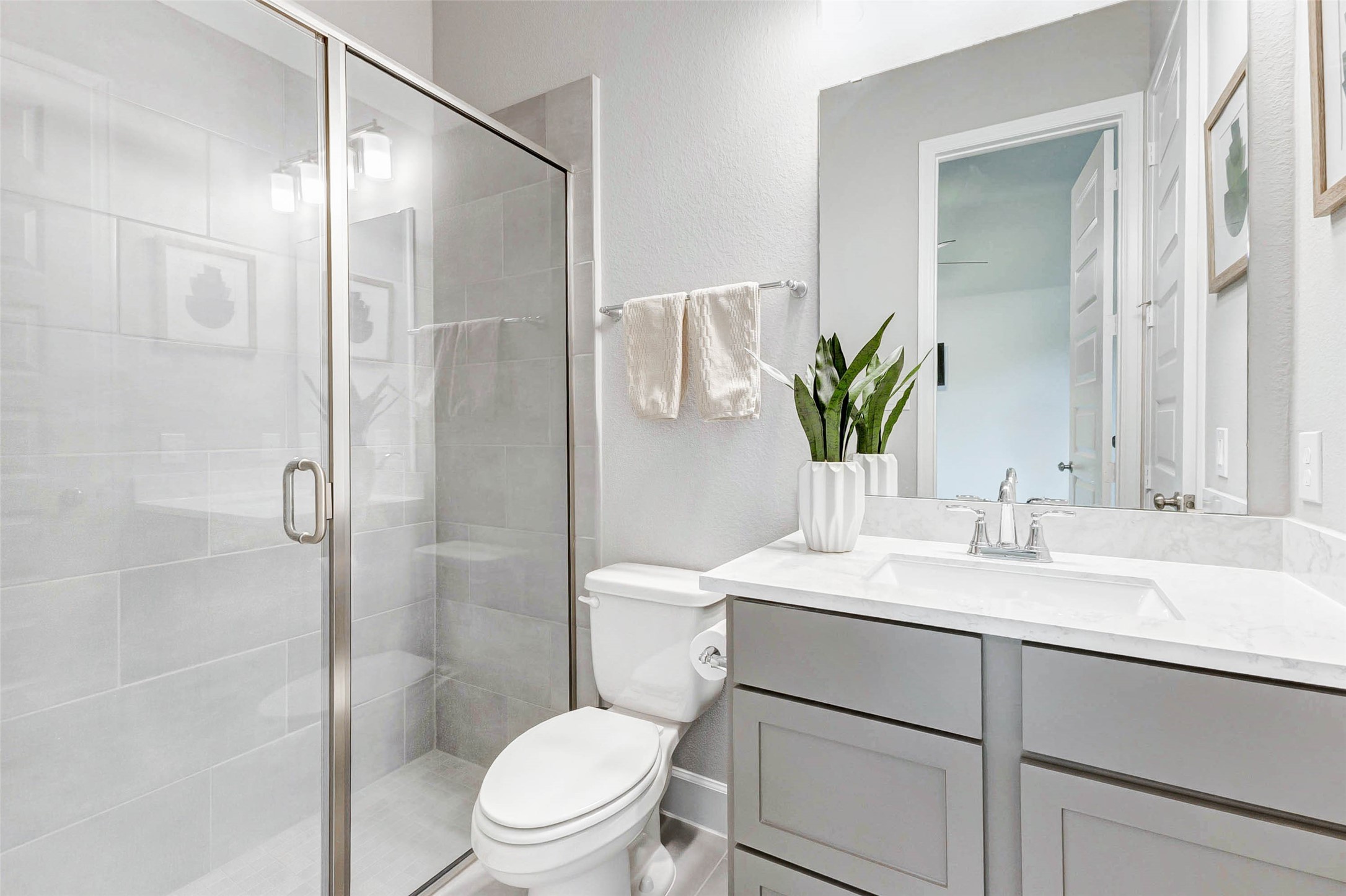 4714 Southpoint Way Fulshear, TX 77441 - Photo 25 of 45 a bathroom with a sink toilet and shower