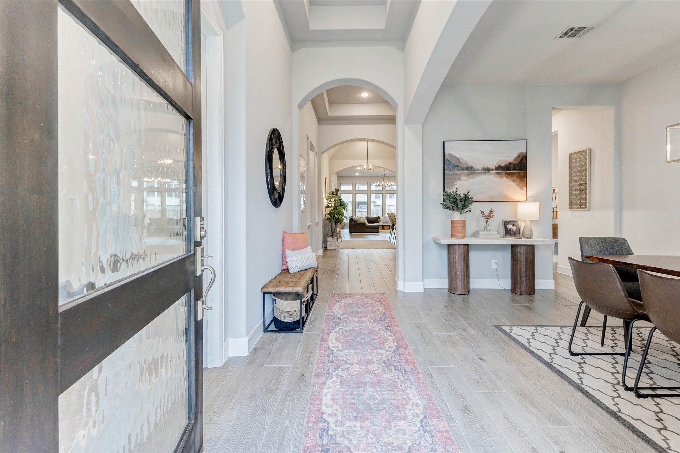 4714 Southpoint Way Fulshear, TX 77441 - Photo 3 of 45 a living room with furniture a large window and wooden floor