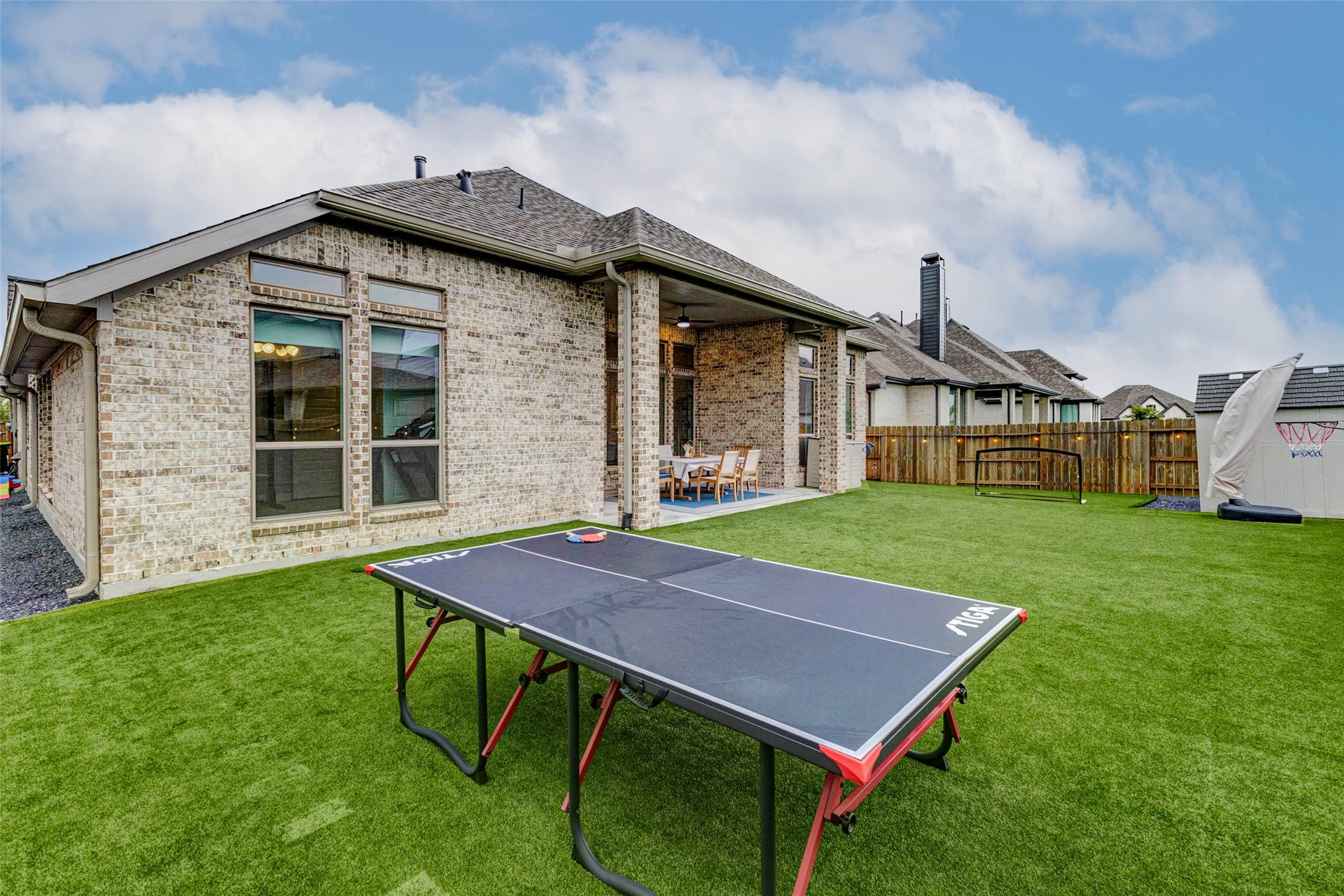 4714 Southpoint Way Fulshear, TX 77441 - Photo 31 of 45 a view of an house with backyard porch and sitting area