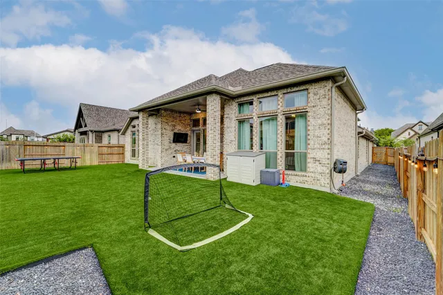 a view of an house with backyard porch and sitting area