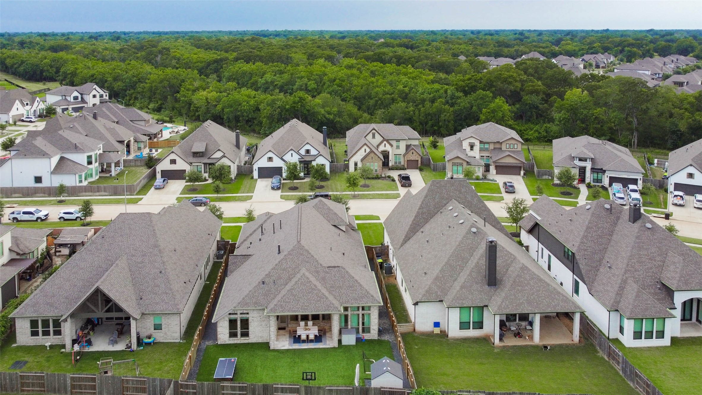 4714 Southpoint Way Fulshear, TX 77441 - Photo 34 of 45 an aerial view of multiple houses with a big yard