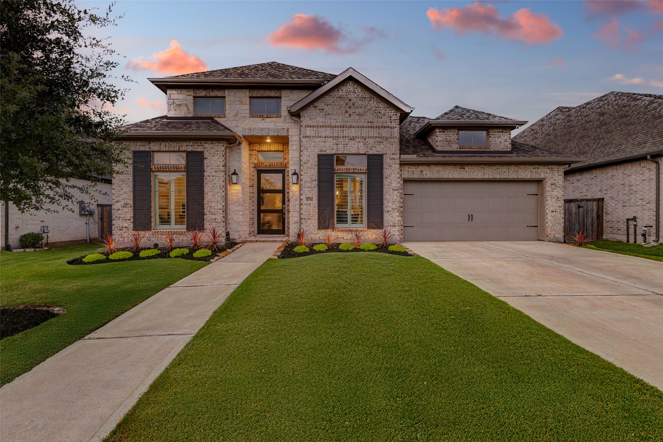 4714 Southpoint Way Fulshear, TX 77441 - Photo 42 of 45 a front view of a house with a yard and porch