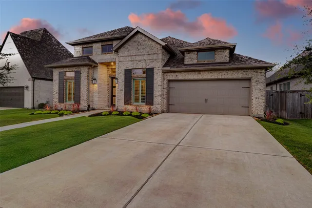 an aerial view of a house with a garden