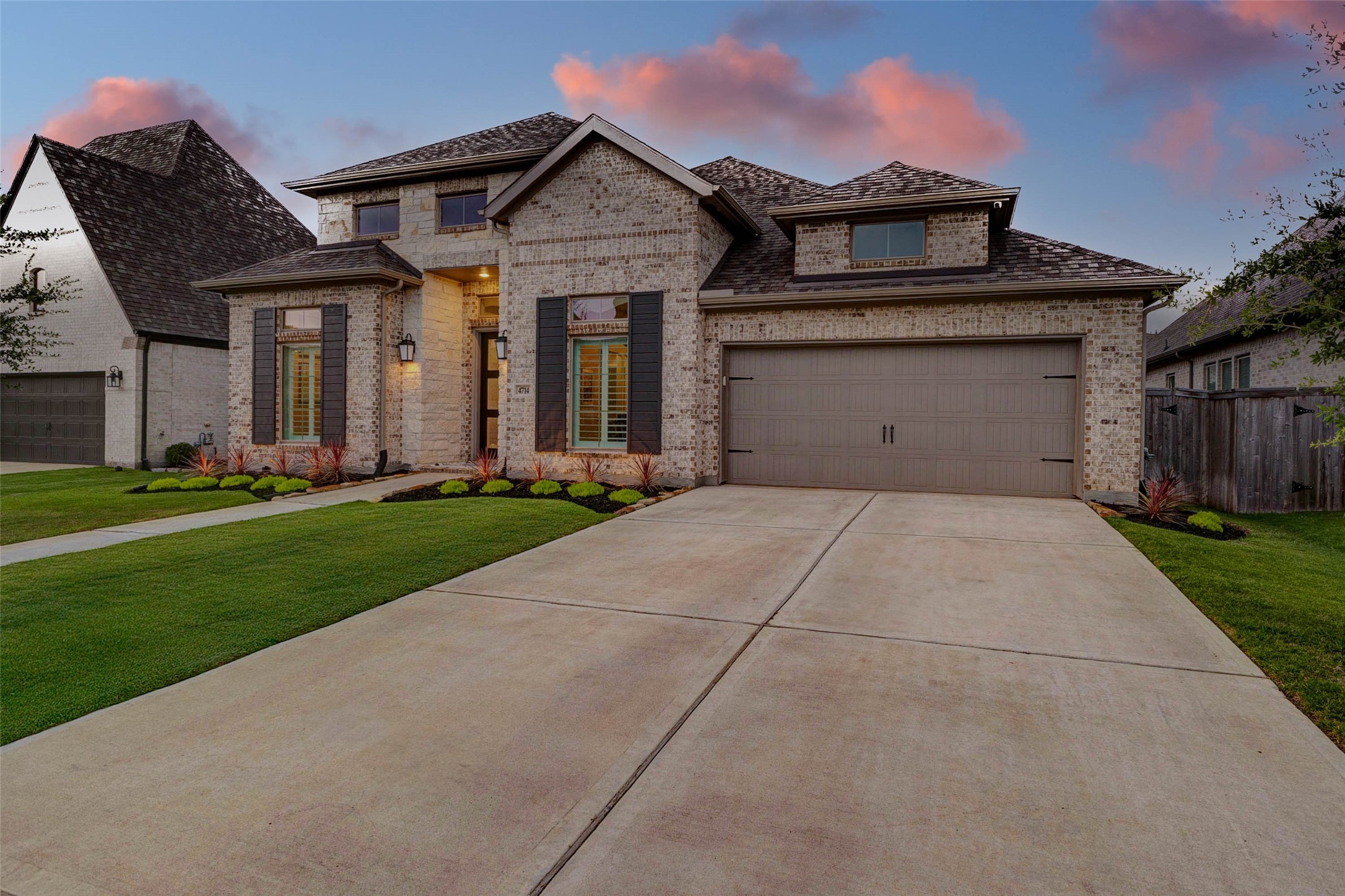 4714 Southpoint Way Fulshear, TX 77441 - Photo 43 of 45 a front view of a house with a yard and garage