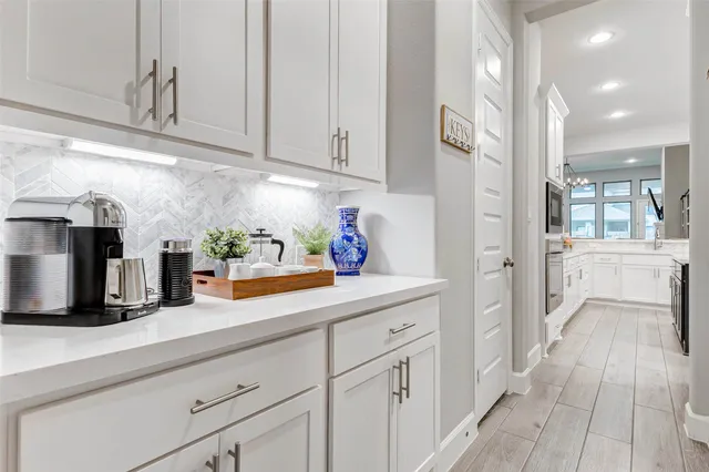 a kitchen with cabinets and window