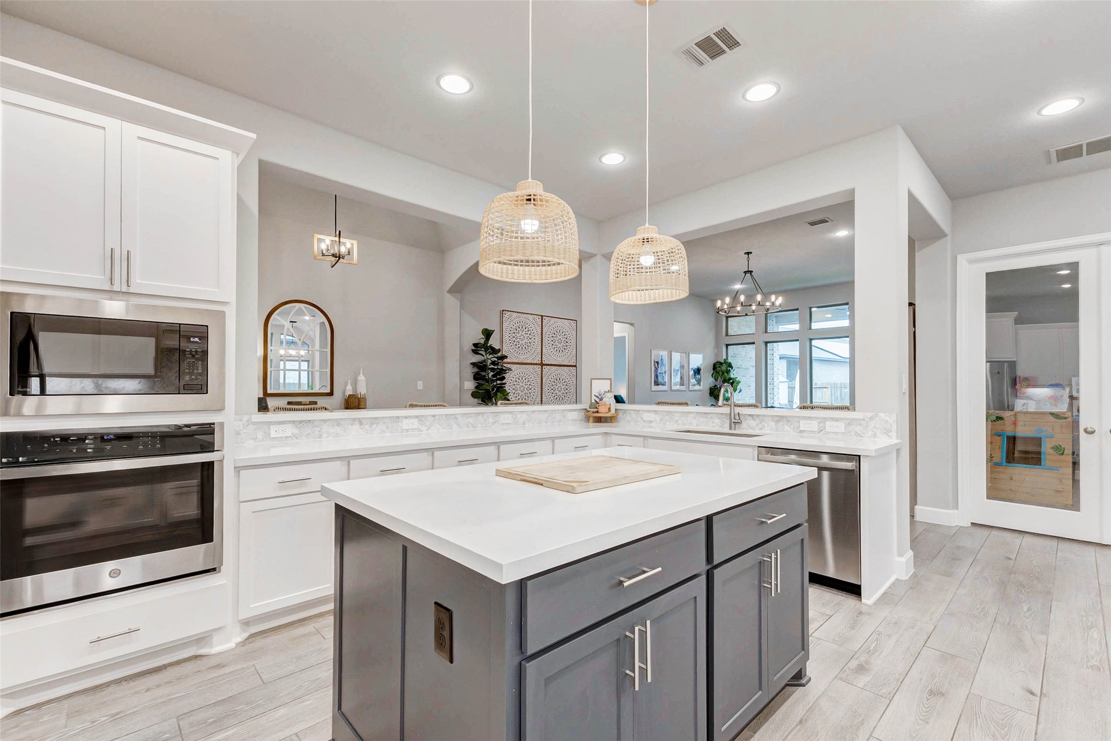 4714 Southpoint Way Fulshear, TX 77441 - Photo 8 of 45 a kitchen with a sink stove and cabinets