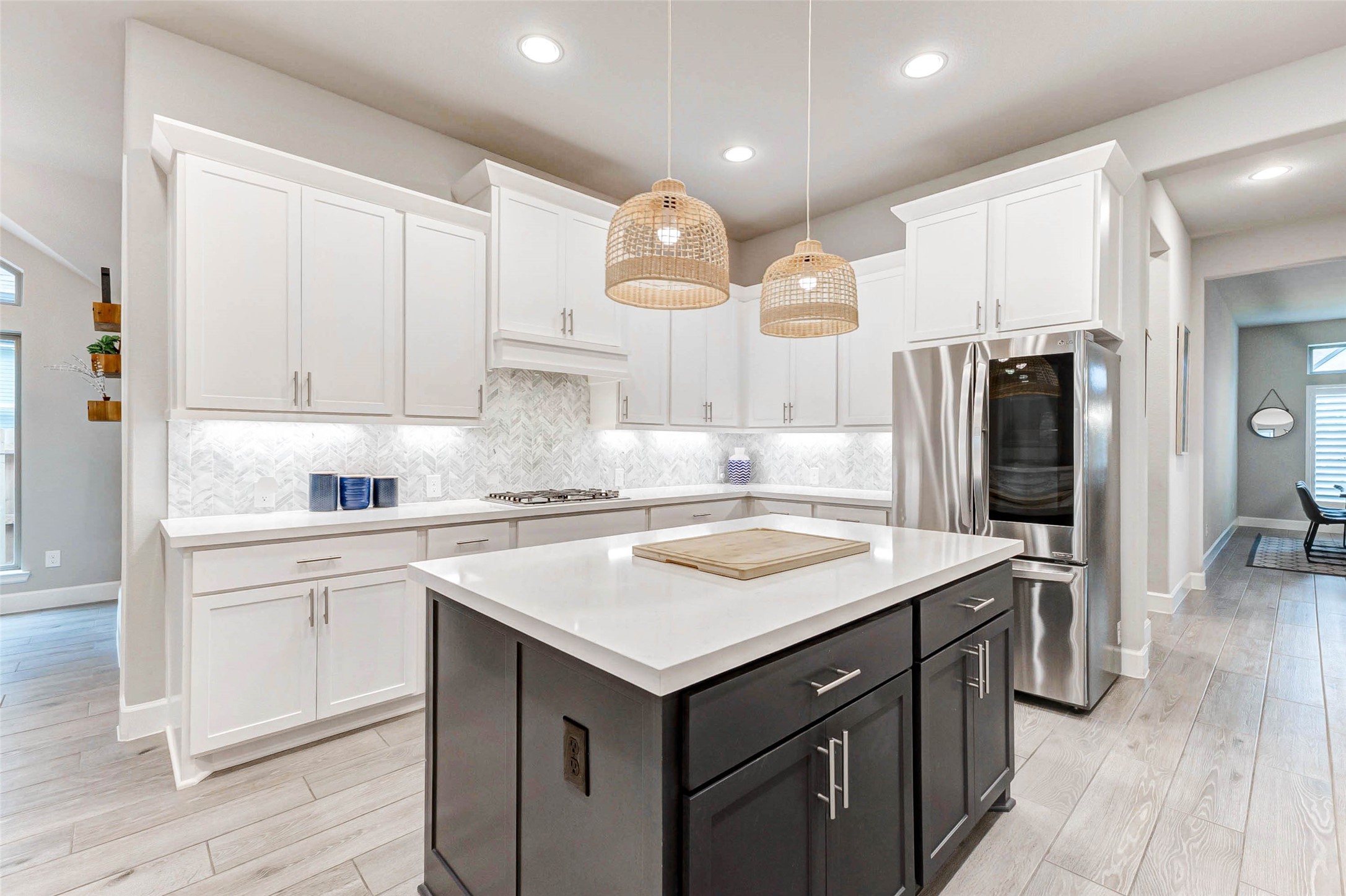 4714 Southpoint Way Fulshear, TX 77441 - Photo 9 of 45 a kitchen with a sink a stove a refrigerator and cabinets