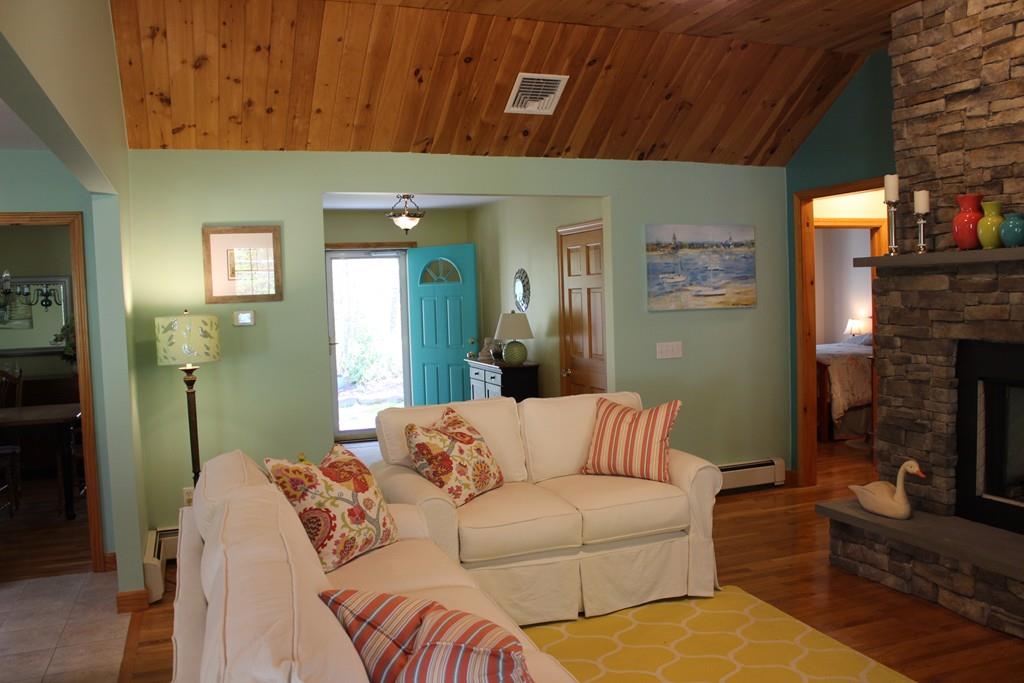 27 A John Dyer Road Little Compton, RI 02837 - Photo 8 of 29 a living room with furniture and a fireplace