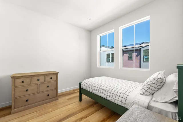 a bedroom with a bed and a dresser