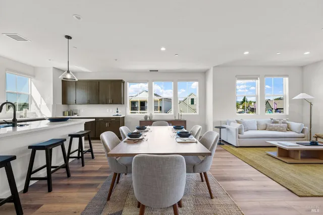 a view of a dining room with furniture window and wooden floor