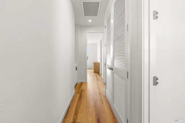 a view of a bathroom from the hallway