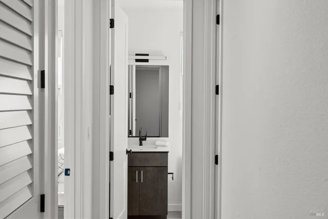 a bathroom with a sink and mirror