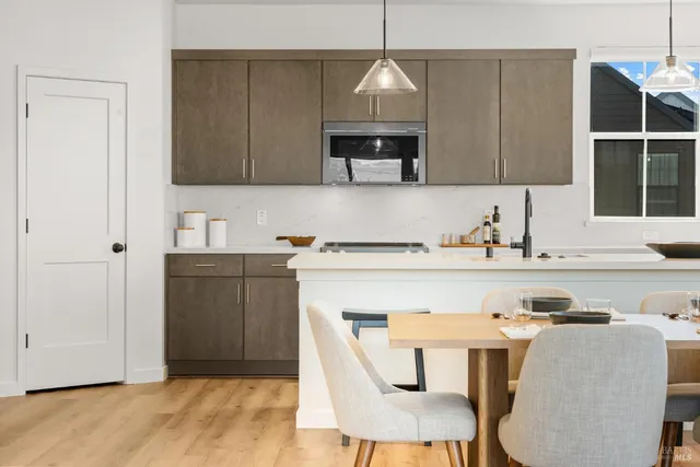 a kitchen with a sink cabinets and window