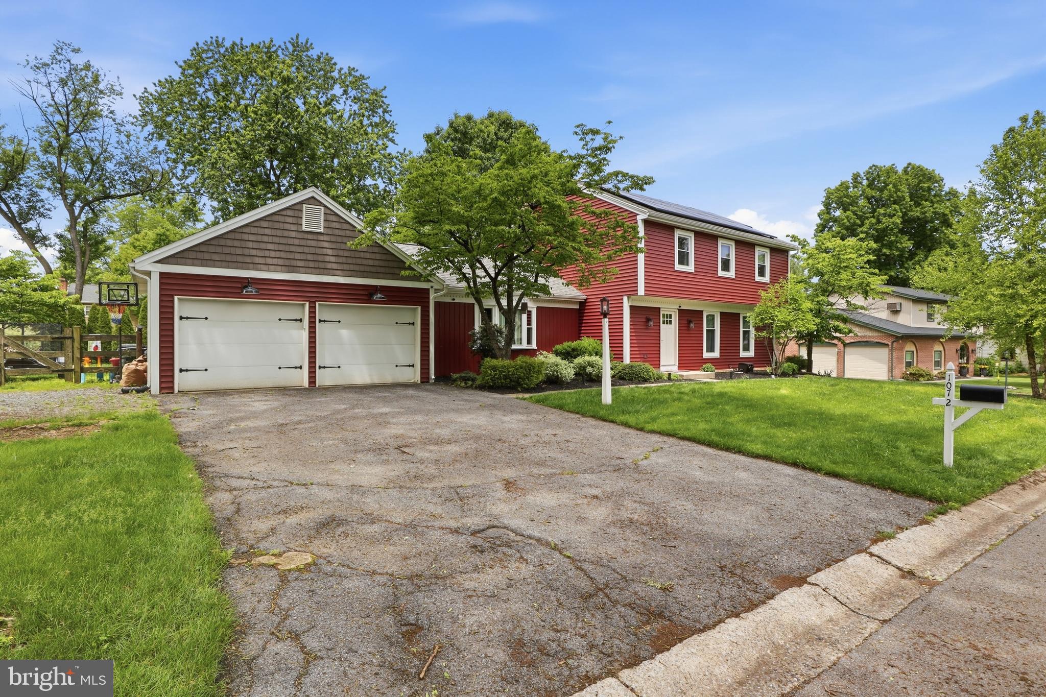 1072 Lambley Road Landisville, PA 17538 - Photo 25 of 46 a front view of a house with a yard and garage
