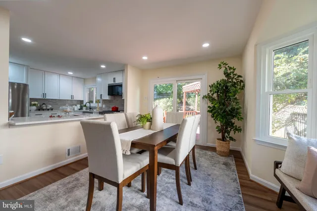 a kitchen with stainless steel appliances a sink stove and refrigerator