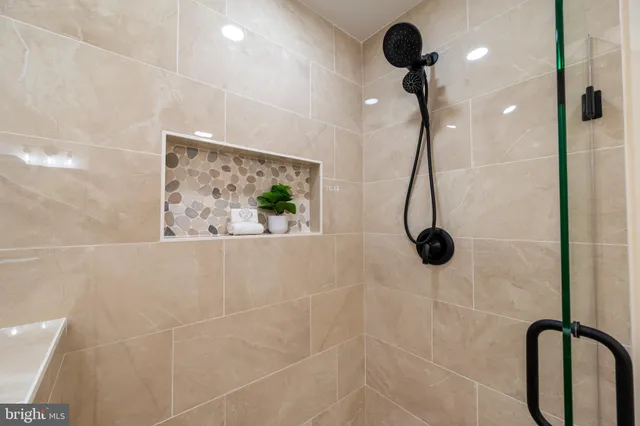 a view of a house with swimming pool and sitting area