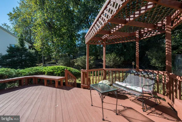 an aerial view of a house with a yard and lake view