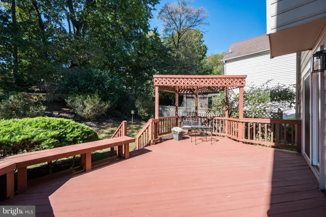 an aerial view of a house with a yard and lake view