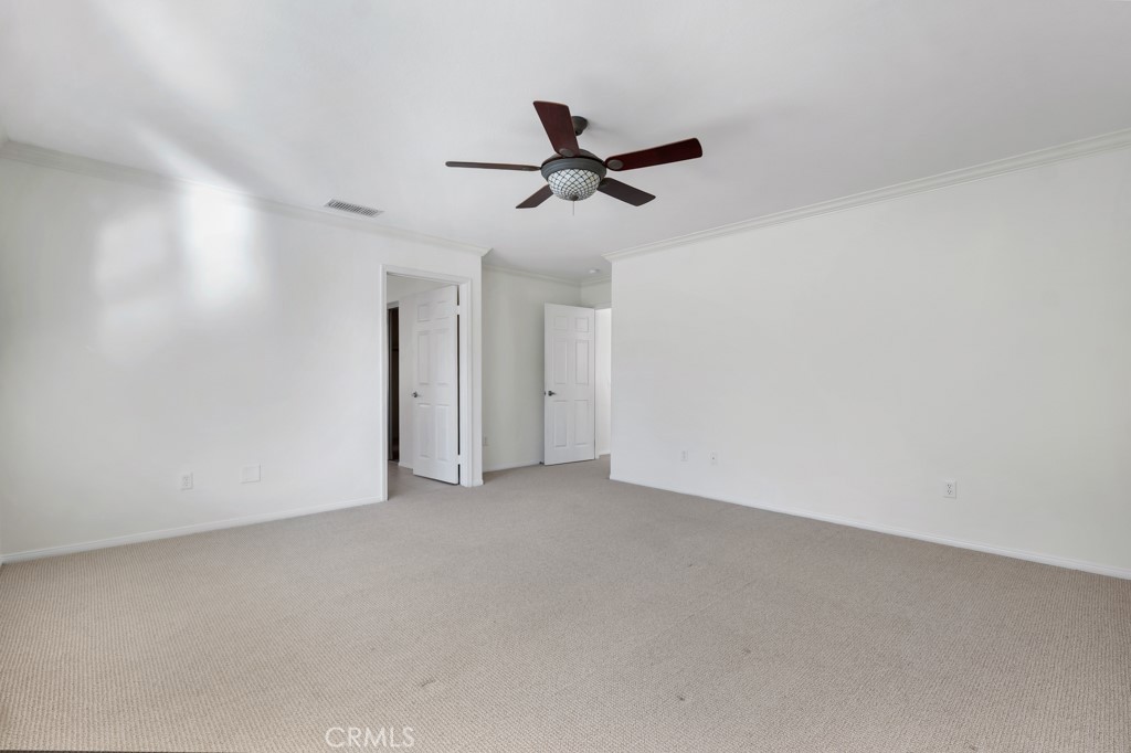11205 Salerno Porter Ranch Porter Ranch, CA 91326 - Photo 26 of 43 an empty room with a ceiling fan and window