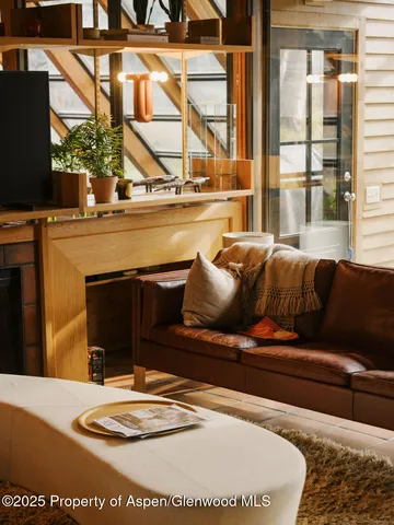 a living room with a couch and a table