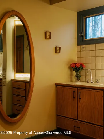 a bathroom with a bathtub and shower