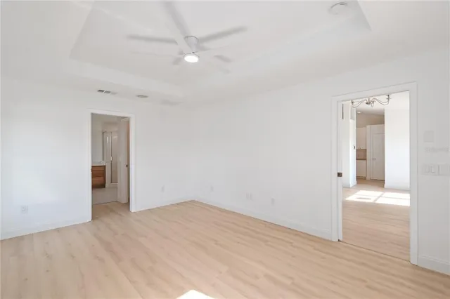a spacious bathroom with a tub shower and sink