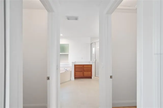 a bathroom with double vanity sink and mirror