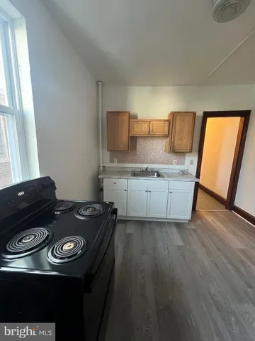 a kitchen with a stove and a microwave
