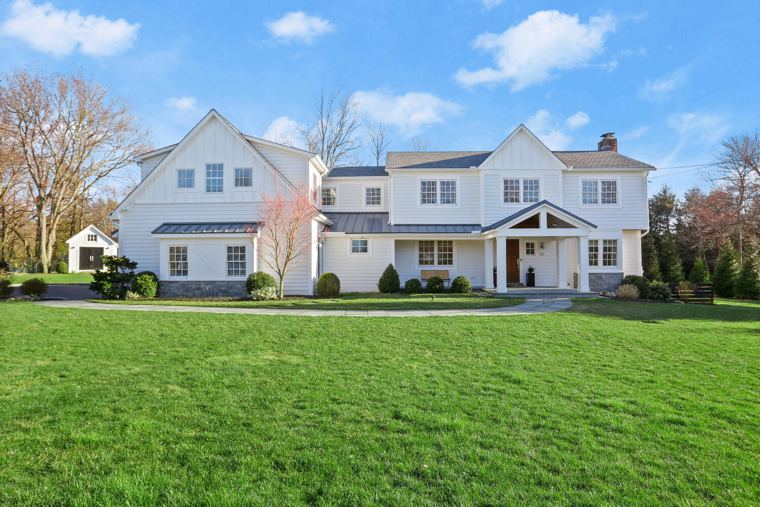 a front view of a house with a yard