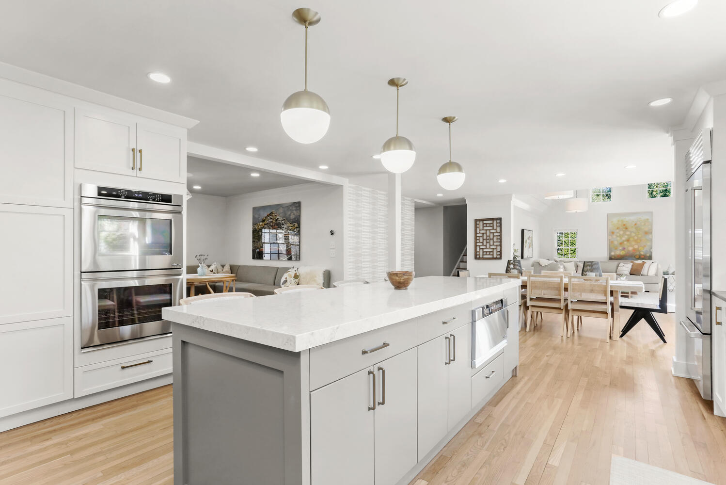 50 Summit Ridge Road New Canaan, CT 06840 - Photo 16 of 49 a large white kitchen with a center island wooden floor and stainless steel appliances