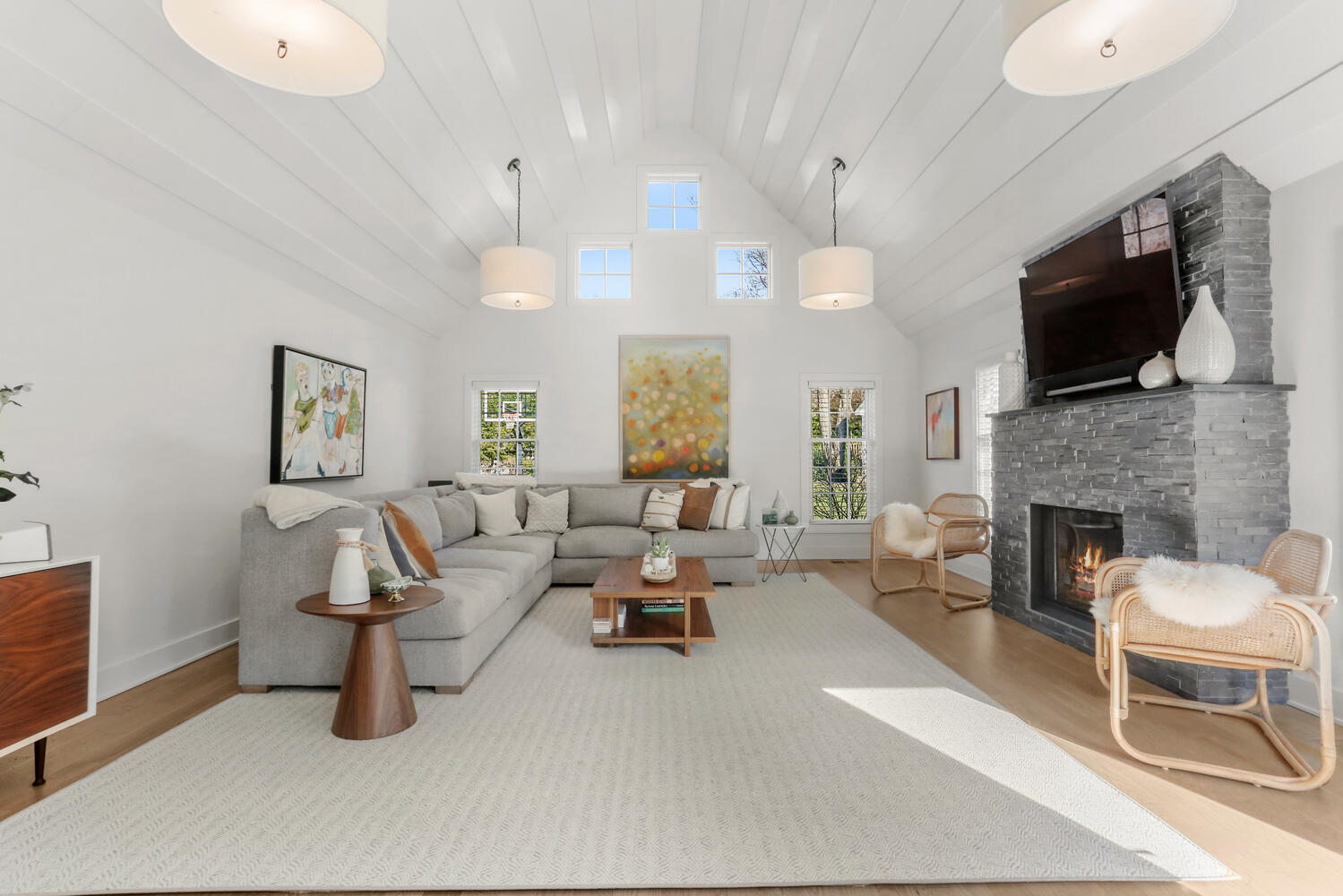 50 Summit Ridge Road New Canaan, CT 06840 - Photo 19 of 49 a living room with furniture a fireplace and a flat screen tv