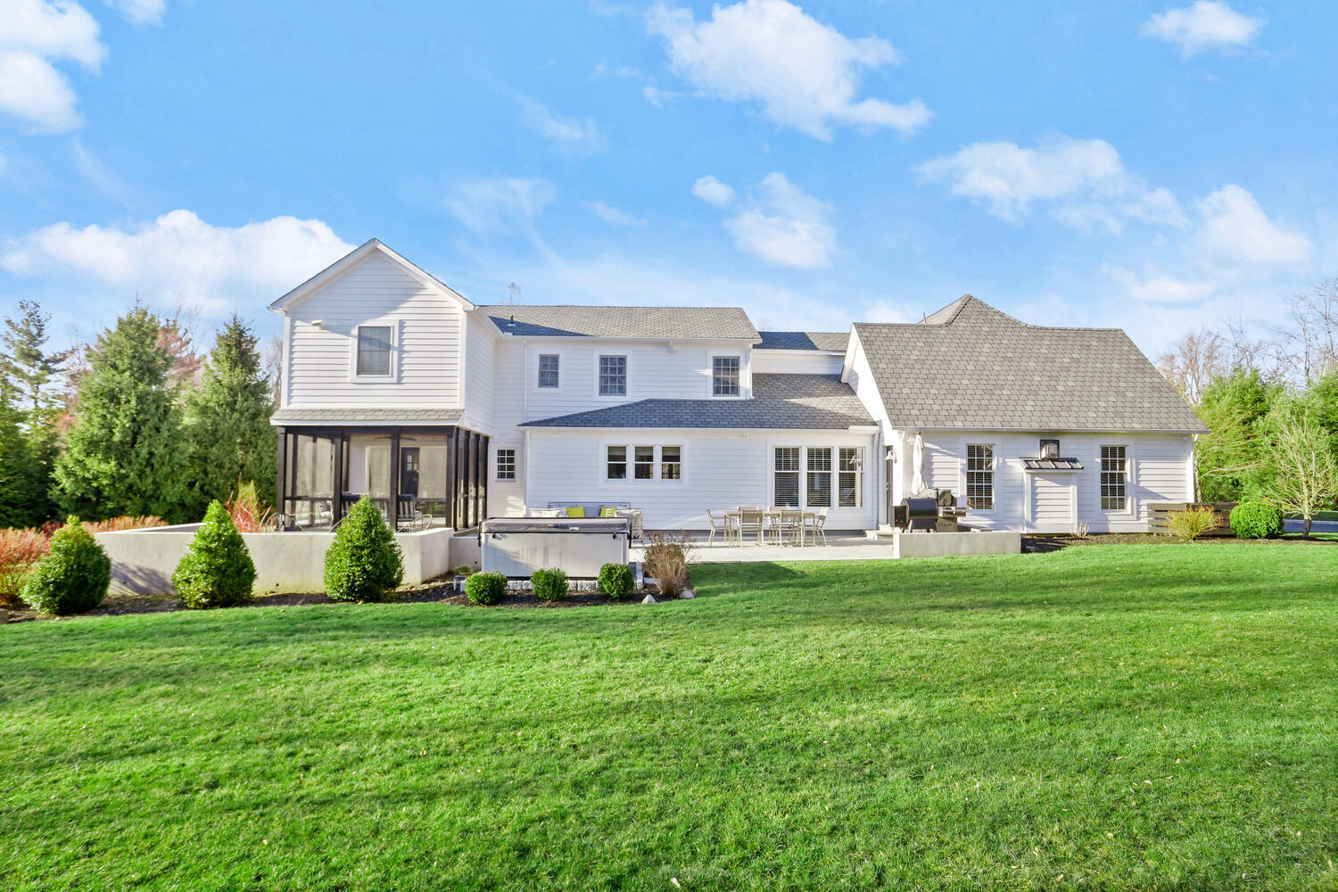 50 Summit Ridge Road New Canaan, CT 06840 - Photo 3 of 49 a front view of a house with garden and trees