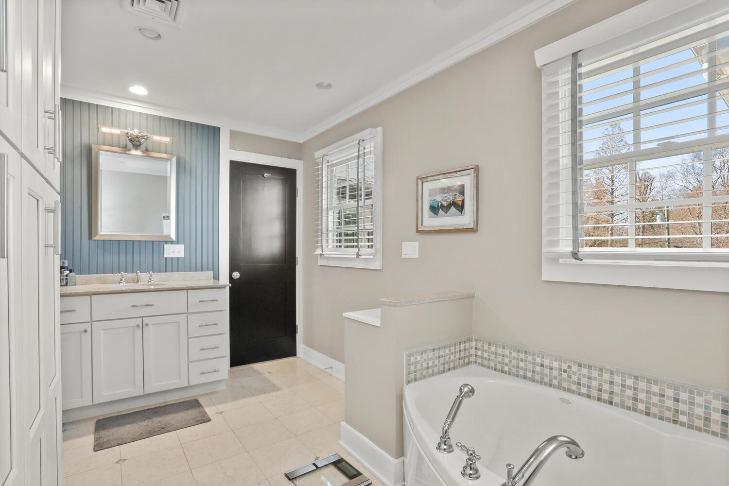 50 Summit Ridge Road New Canaan, CT 06840 - Photo 35 of 49 a spacious bathroom with a tub sink and mirror