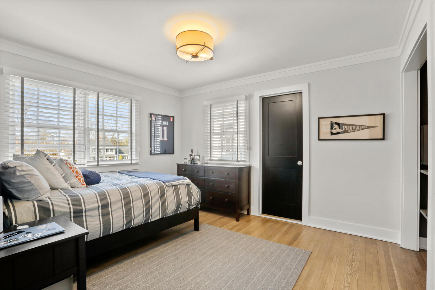 50 Summit Ridge Road New Canaan, CT 06840 - Photo 36 of 49 a bedroom with a bed and wooden floor