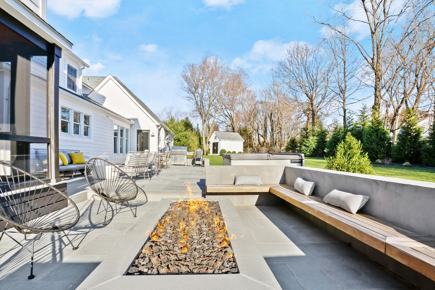 50 Summit Ridge Road New Canaan, CT 06840 - Photo 45 of 49 a view of swimming pool with outdoor seating and trees