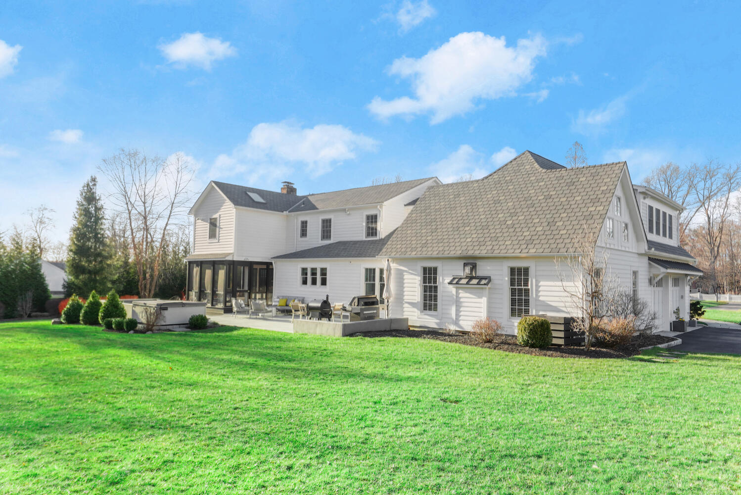 50 Summit Ridge Road New Canaan, CT 06840 - Photo 48 of 49 a front view of a house with garden and houses