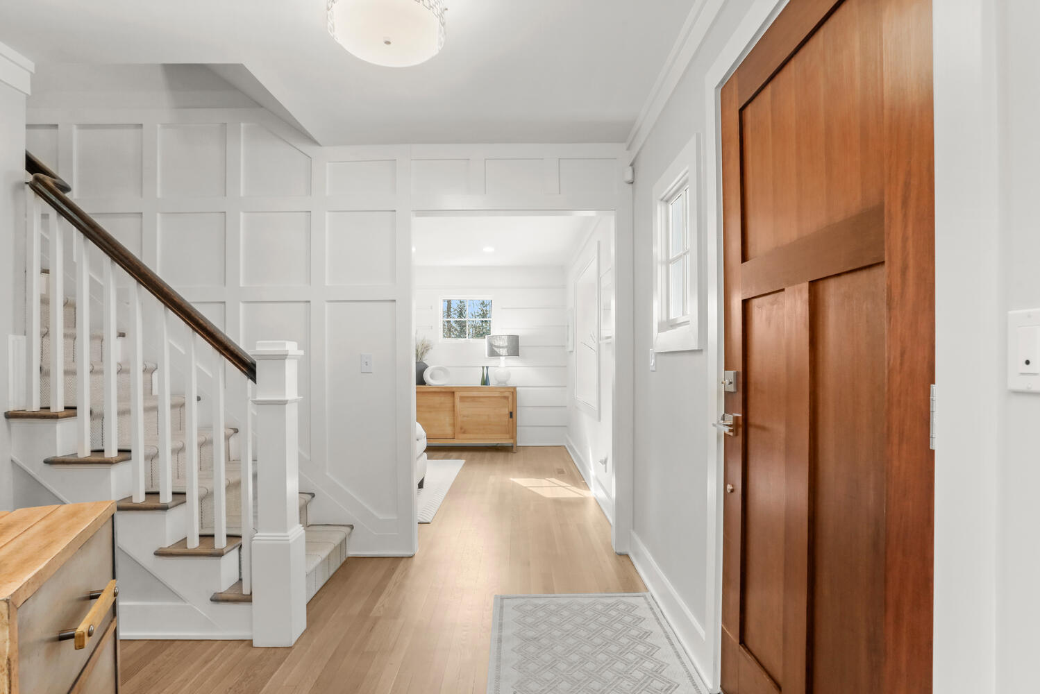 50 Summit Ridge Road New Canaan, CT 06840 - Photo 5 of 49 a view of a hallway view with wooden floor and staircase