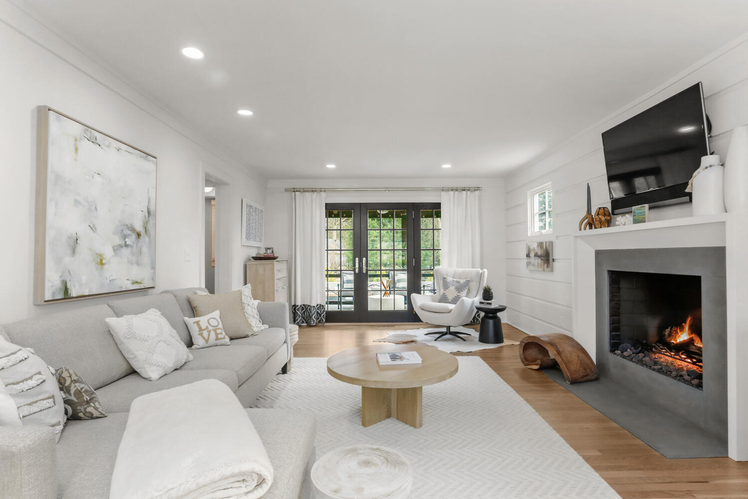 50 Summit Ridge Road New Canaan, CT 06840 - Photo 6 of 49 a living room with furniture a fireplace and a flat screen tv