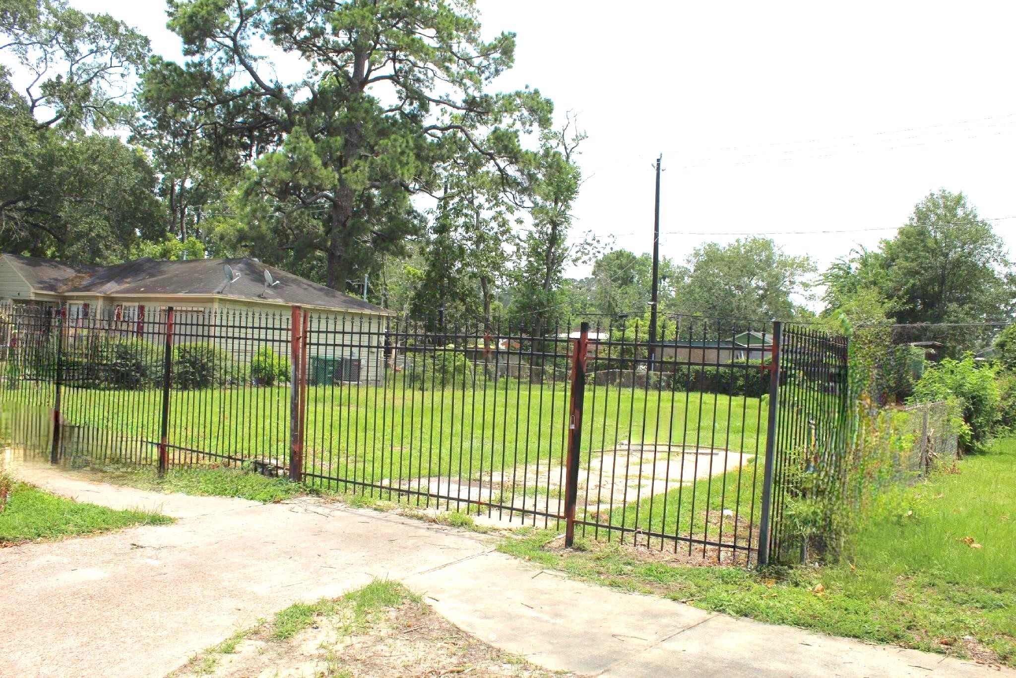 6310 Hartwick Road Houston, TX 77016 - Photo 3 of 6 a view of a fence and a back yard
