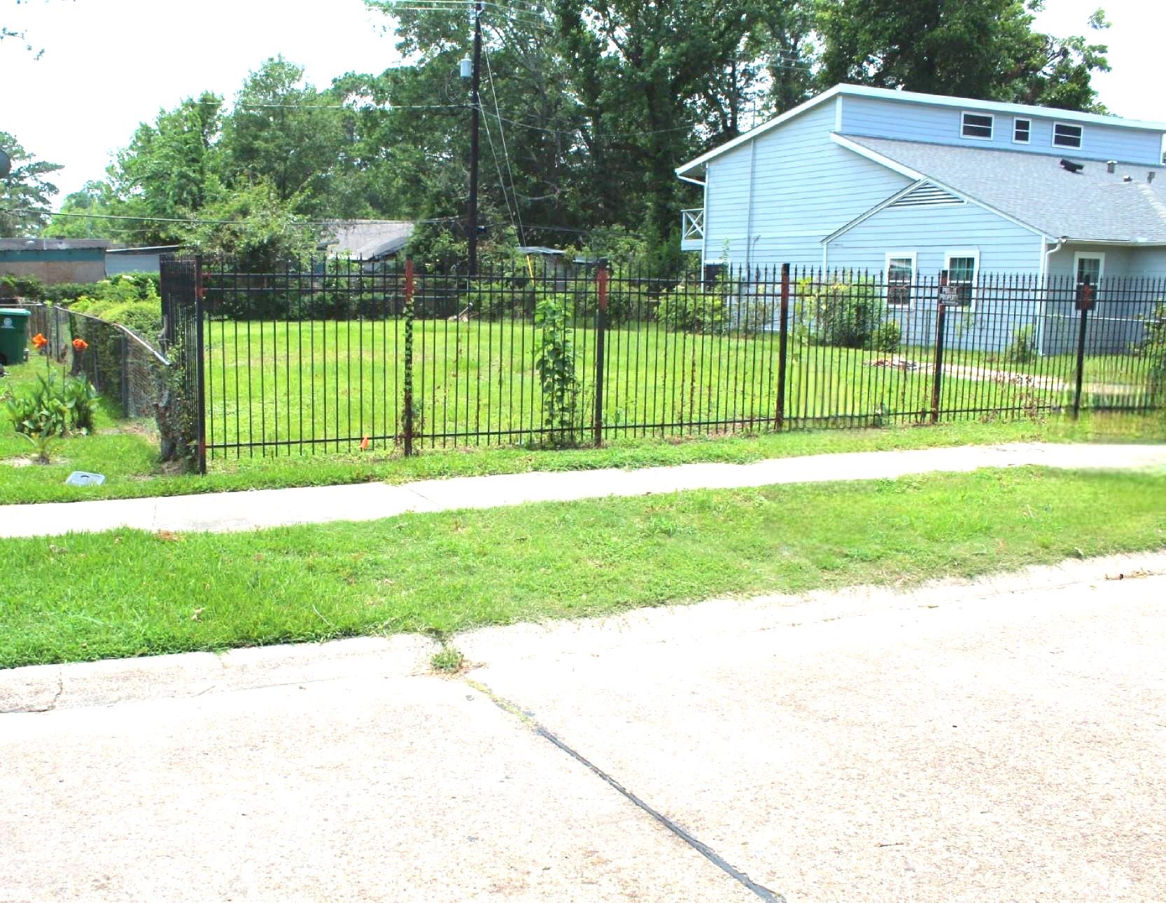 6310 Hartwick Road Houston, TX 77016 - Photo 5 of 6 a view of a house with a backyard and a garden