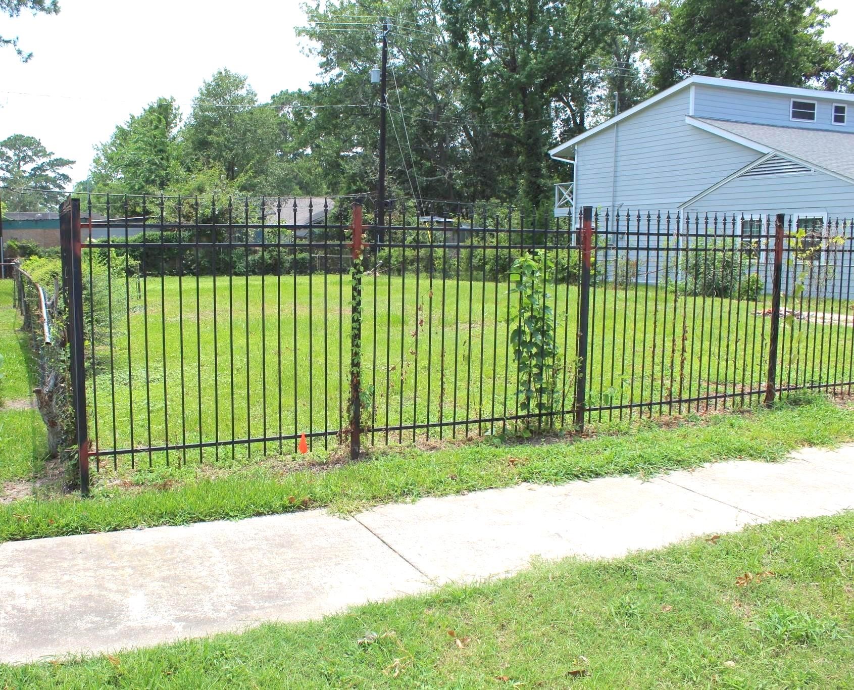 6310 Hartwick Road Houston, TX 77016 - Photo 6 of 6 a view of a backyard with a garden and deck