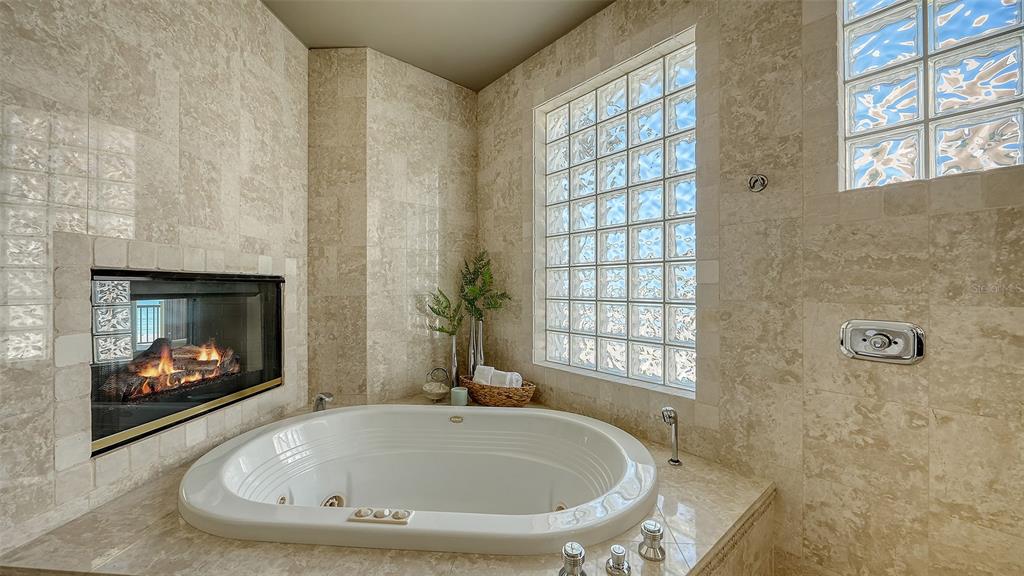 6477 Gulfside Road Longboat Key, FL 34228 - Photo 13 of 65 a bathroom with a sink and a bathtub