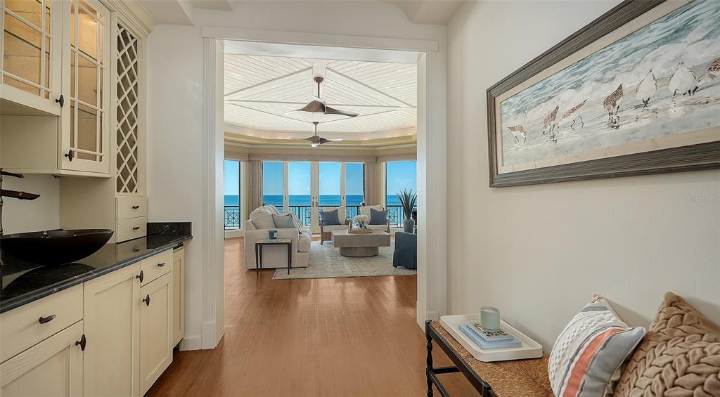 6477 Gulfside Road Longboat Key, FL 34228 - Photo 14 of 65 a living room with furniture and wooden floor